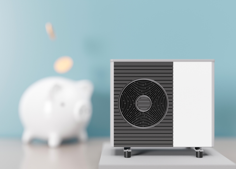 Air,Heat,Pump,And,Piggy,Bank,On,Blue,Background.,Modern,